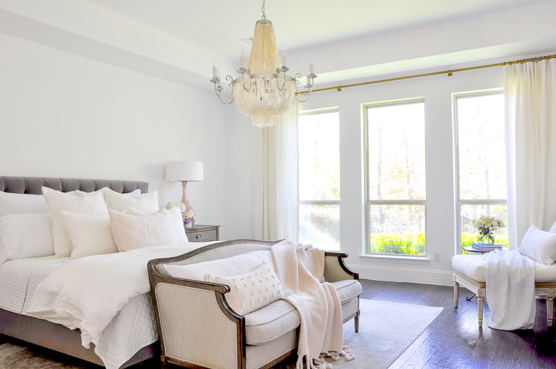 white bedroom with blush accents