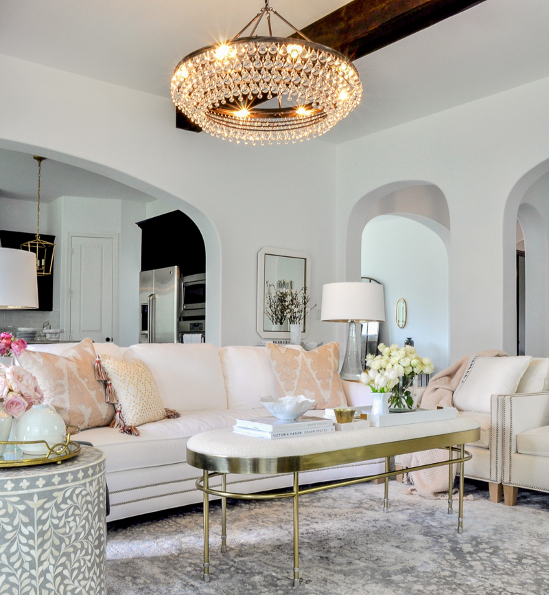 white living room with blush and gold accents