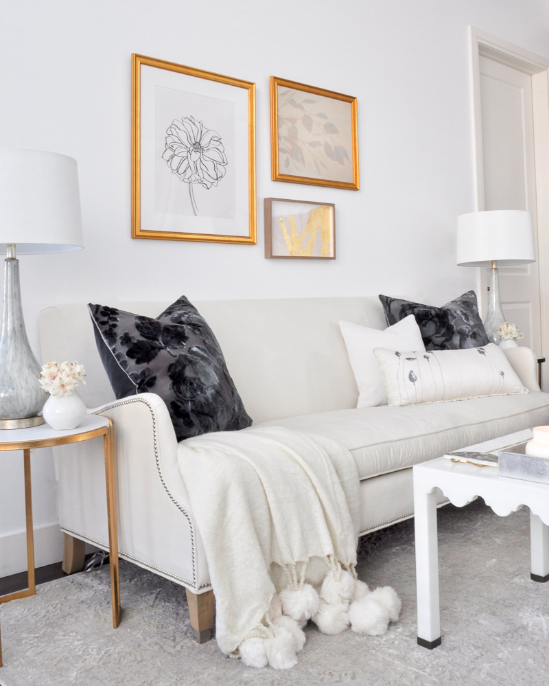 white living room with gold accents