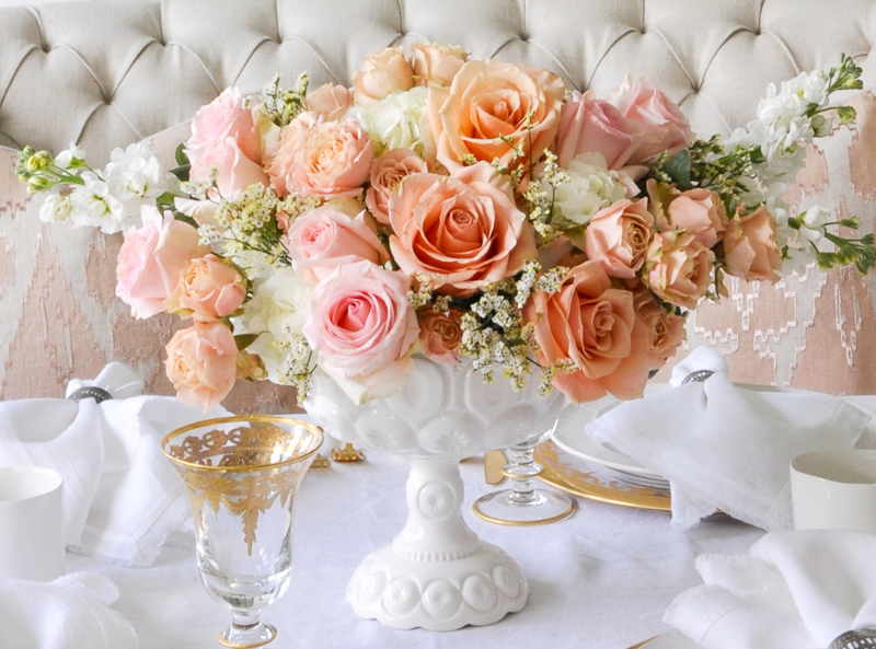 beautiful spring floral arrangement with roses in peach and pink