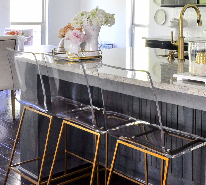 gorgeous lucite and gold barstools in kitchen update