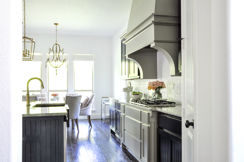 updated kitchen with beautiful cabinets and venthood