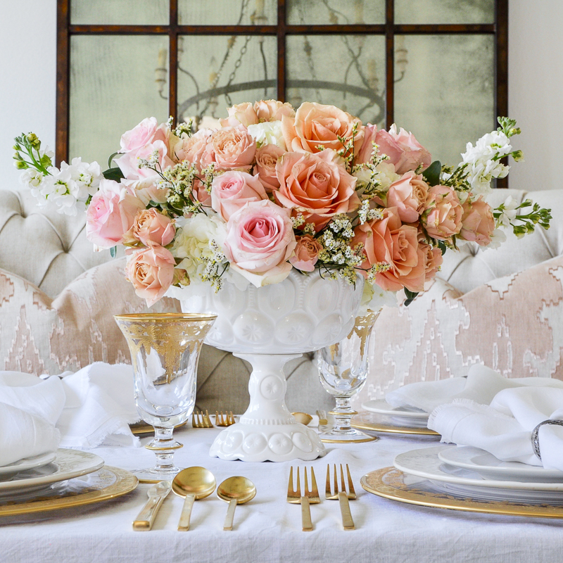 spring floral arrangement with blush and peach roses