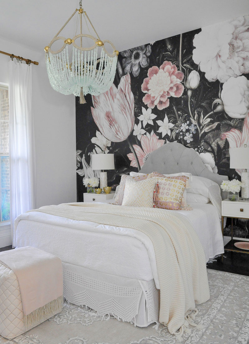 Beautiful bedroom white bedding pink pillows dark floral wallpaper 