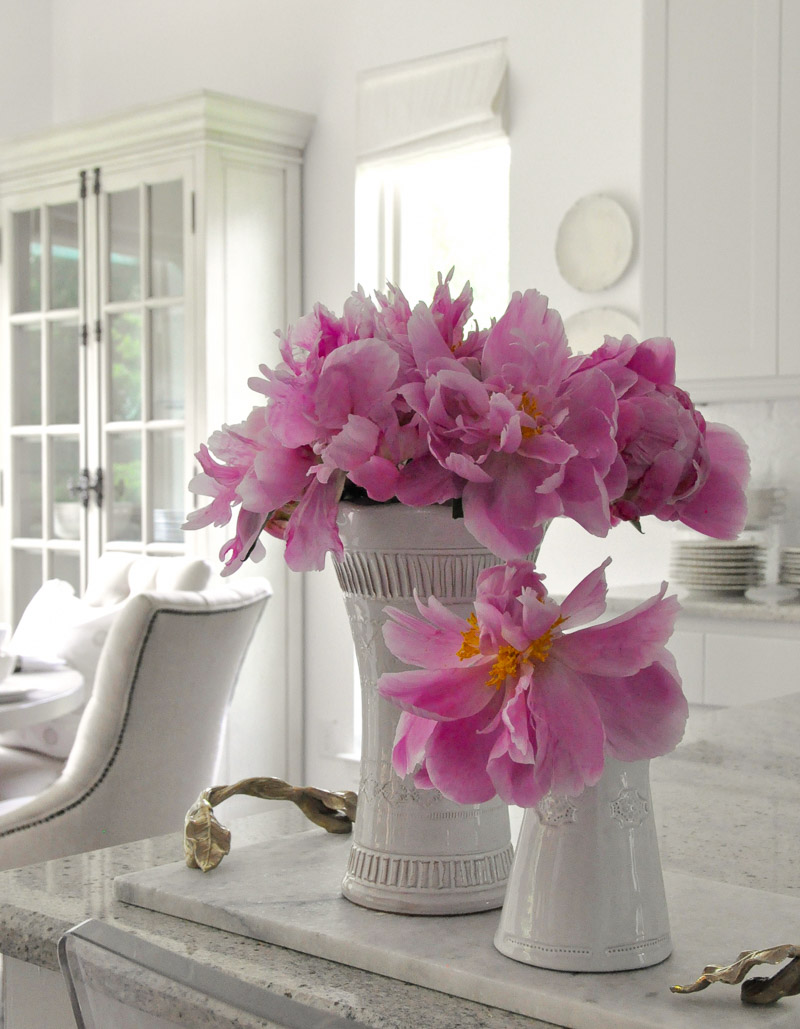 white vases bright pink peonies