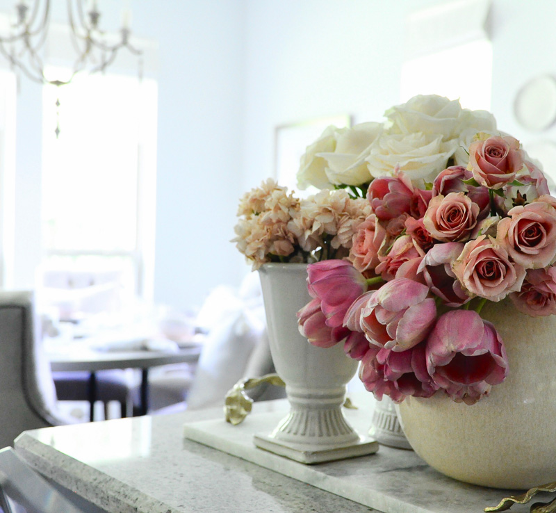 white cream vases flowers kitchen counter