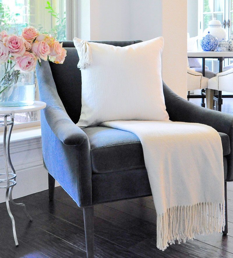 blue velvet chair white pillow tassel