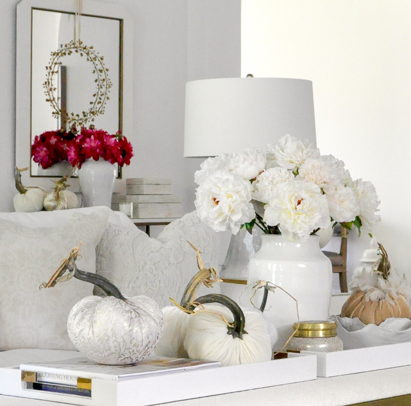 Fall living room cozy white furniture velvet pumpkins 