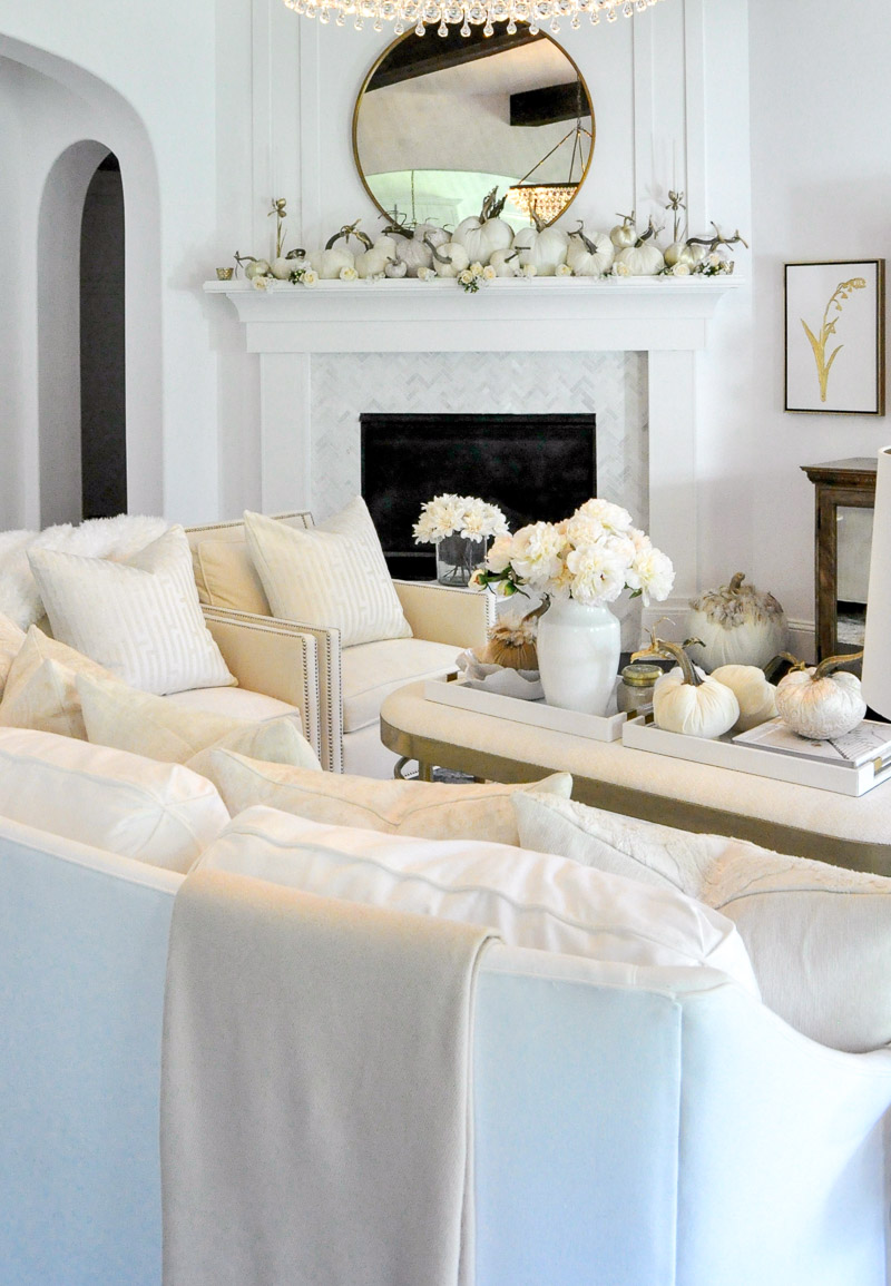 Fall living room white furniture mantel white pumpkins