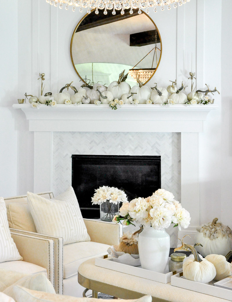 Fall living room white furniture beautiful fireplace surround velvet pumpkins 