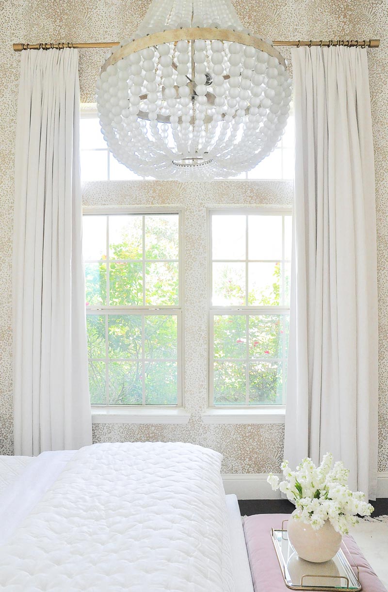 Guest room long white linen draperies 
