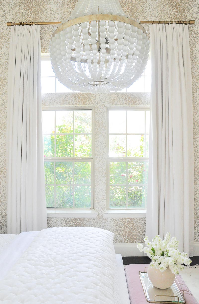 Guest room long white linen draperies 