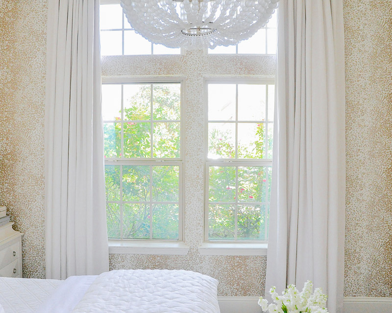 Guest bedroom elegant white draperies 