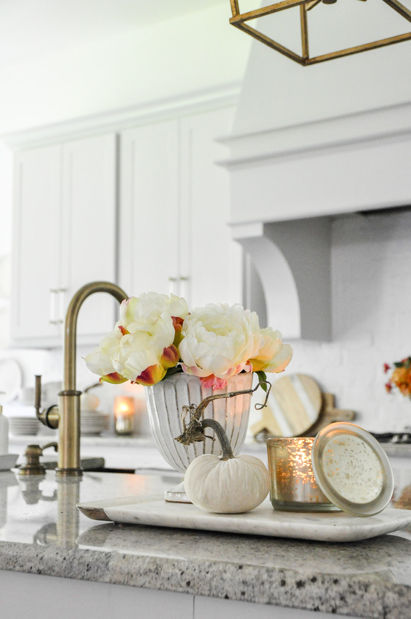 Kitchen brass faucet light gray cabinets 