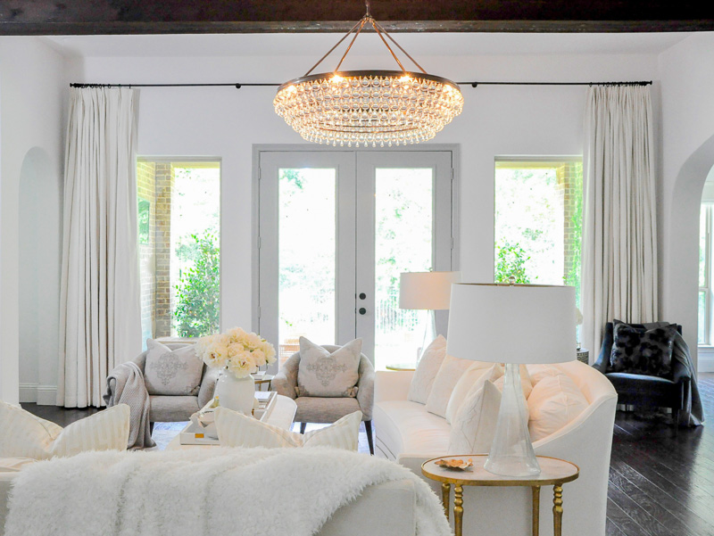 living room white drapery panels gorgeous chandelier