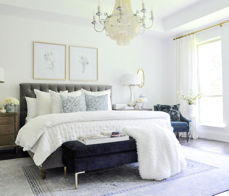 Master bedroom gray tufted bed