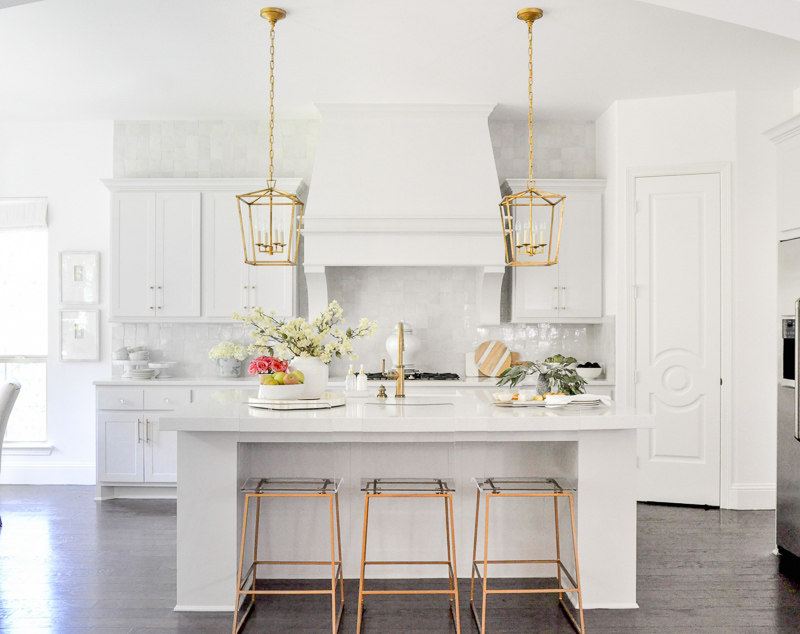 Kitchen reveal white quartz countertops large vent hood symmetrical design 