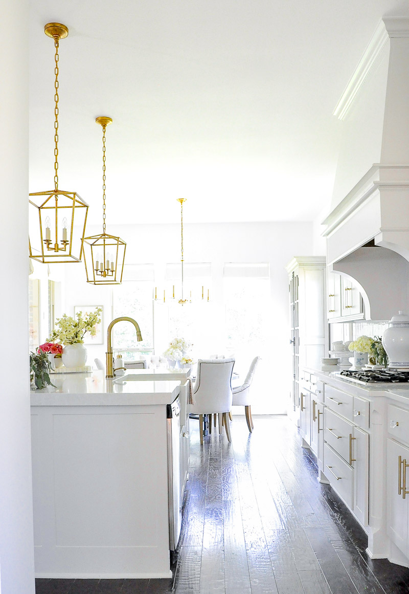 White kitchen statement vent hood large island 