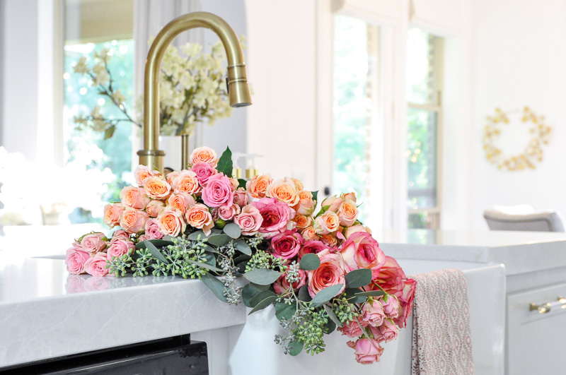 Kitchen white farm sink quartz countertops brass faucet 