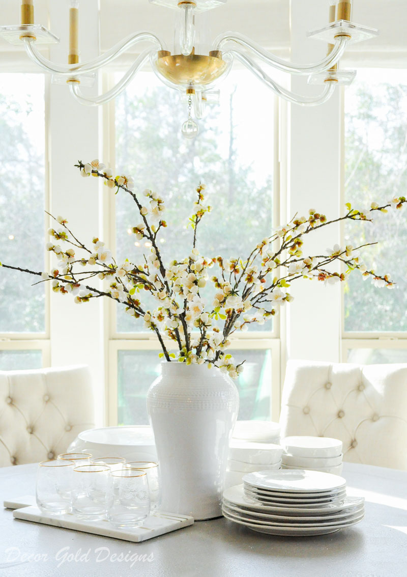 breakfast nook round table vase full branches