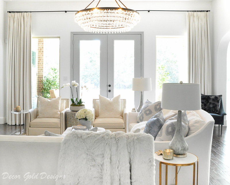 cozy living room white gray beautiful doors chandelier