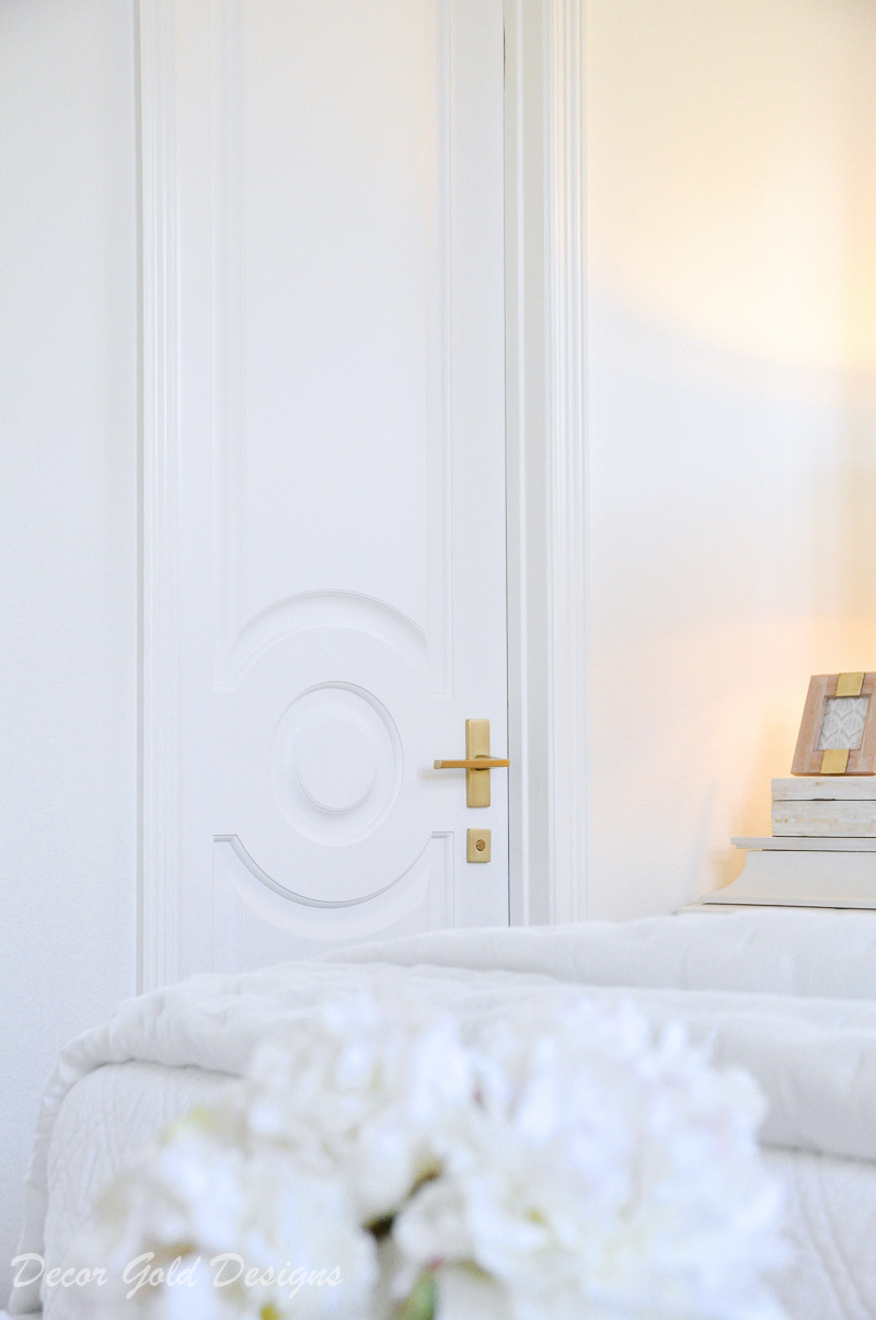 beautiful bedroom white door brass lever