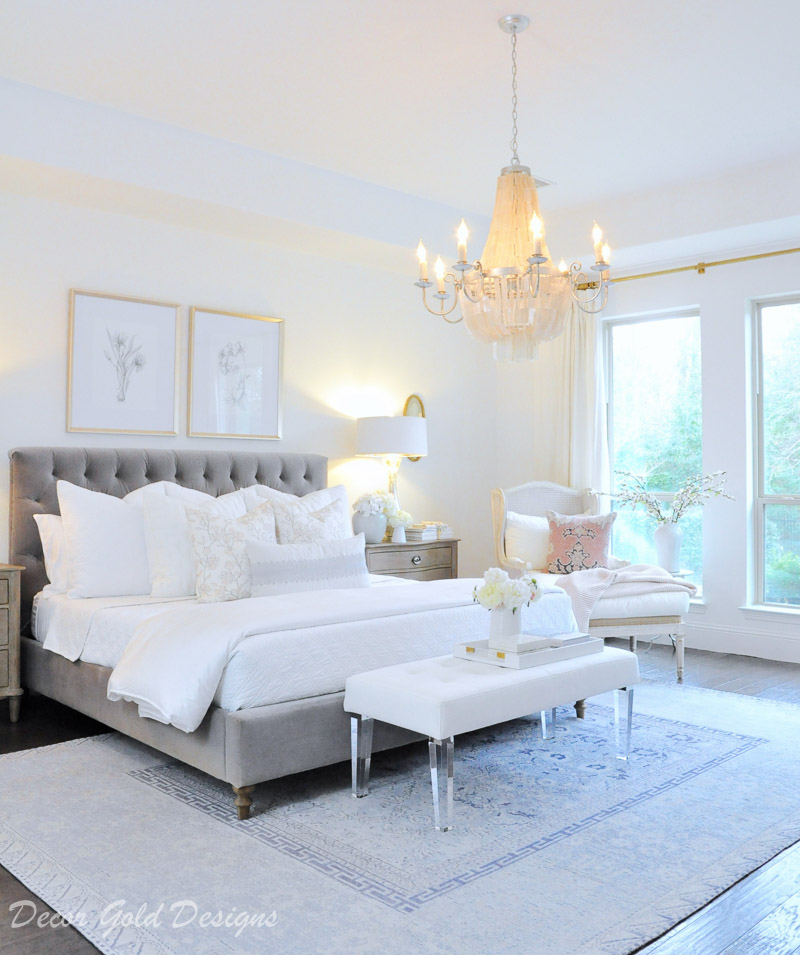 bedroom white bedding gray bed blue rug