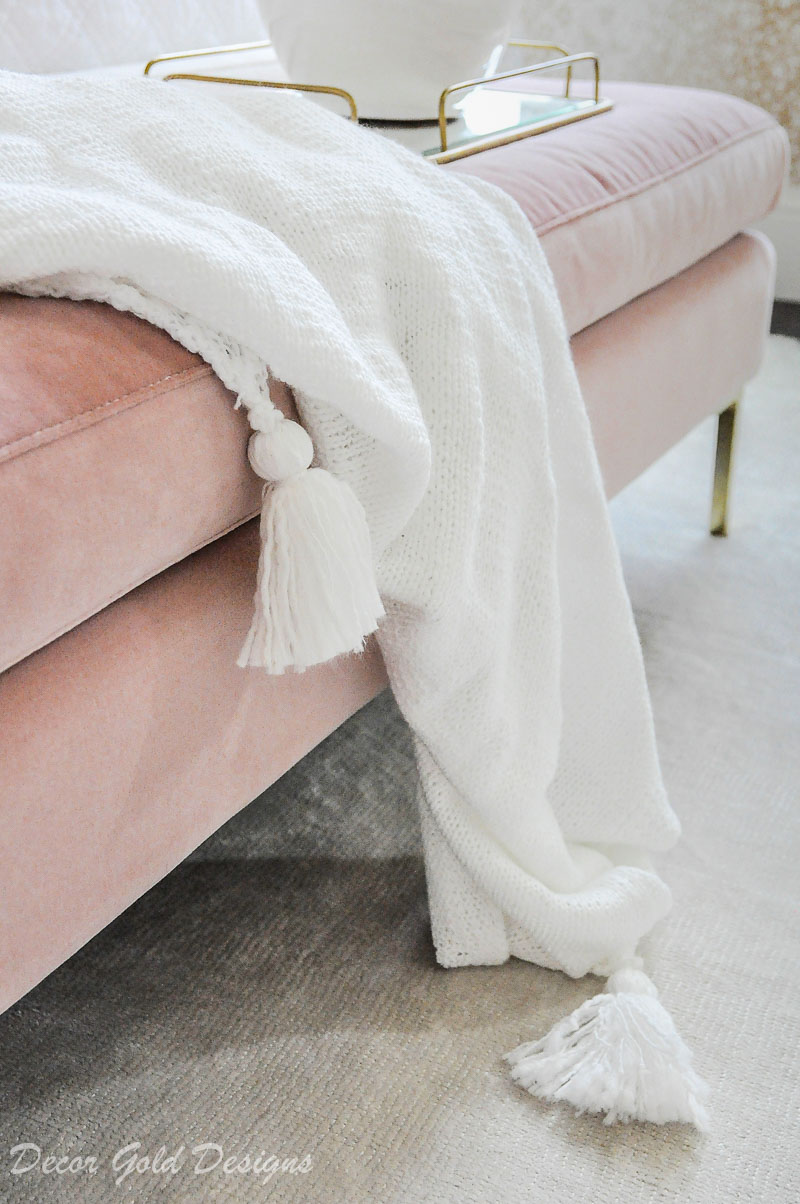 Tassel throw blanket pink bench