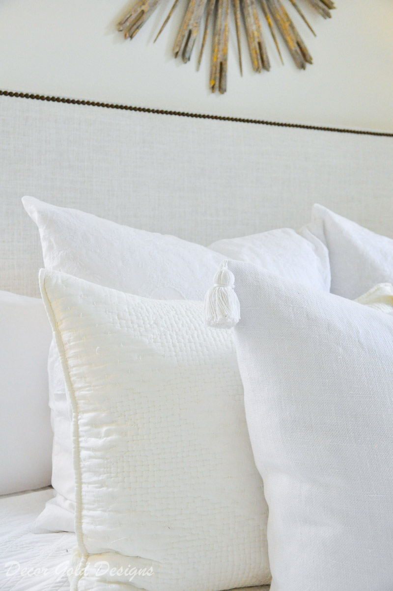 white bed pillows tassels