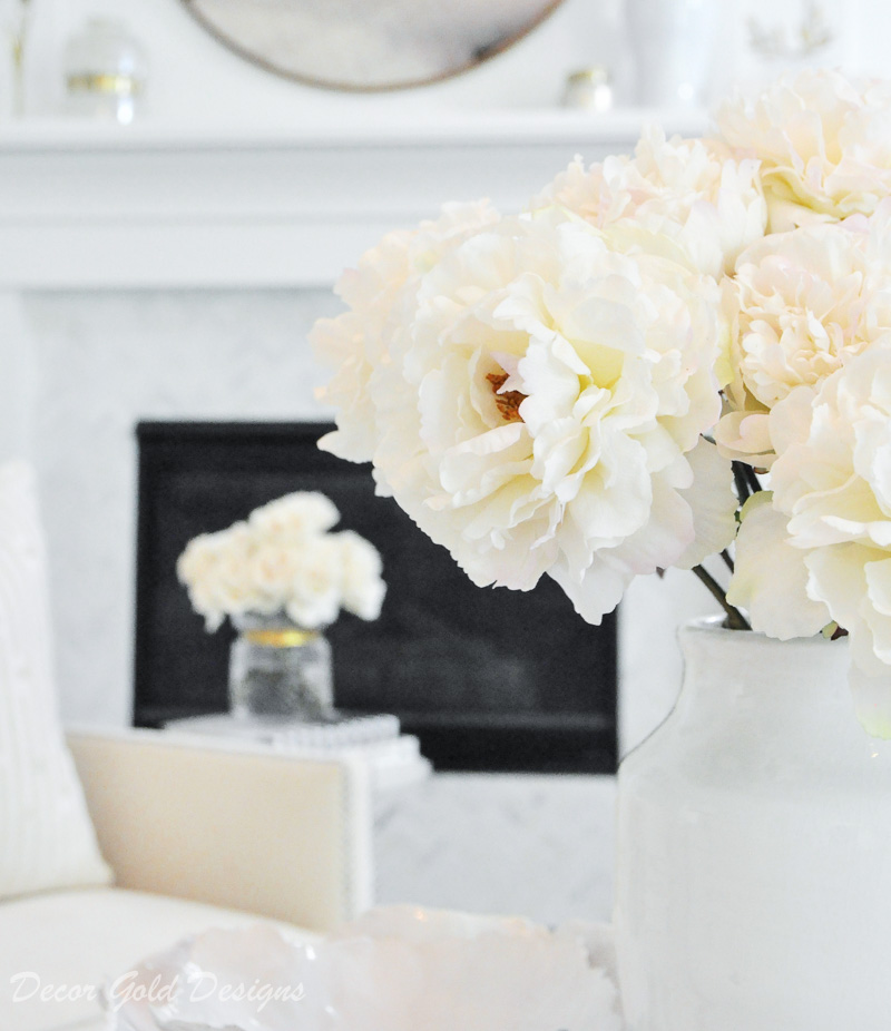 faux flowers beautifully styled white vase