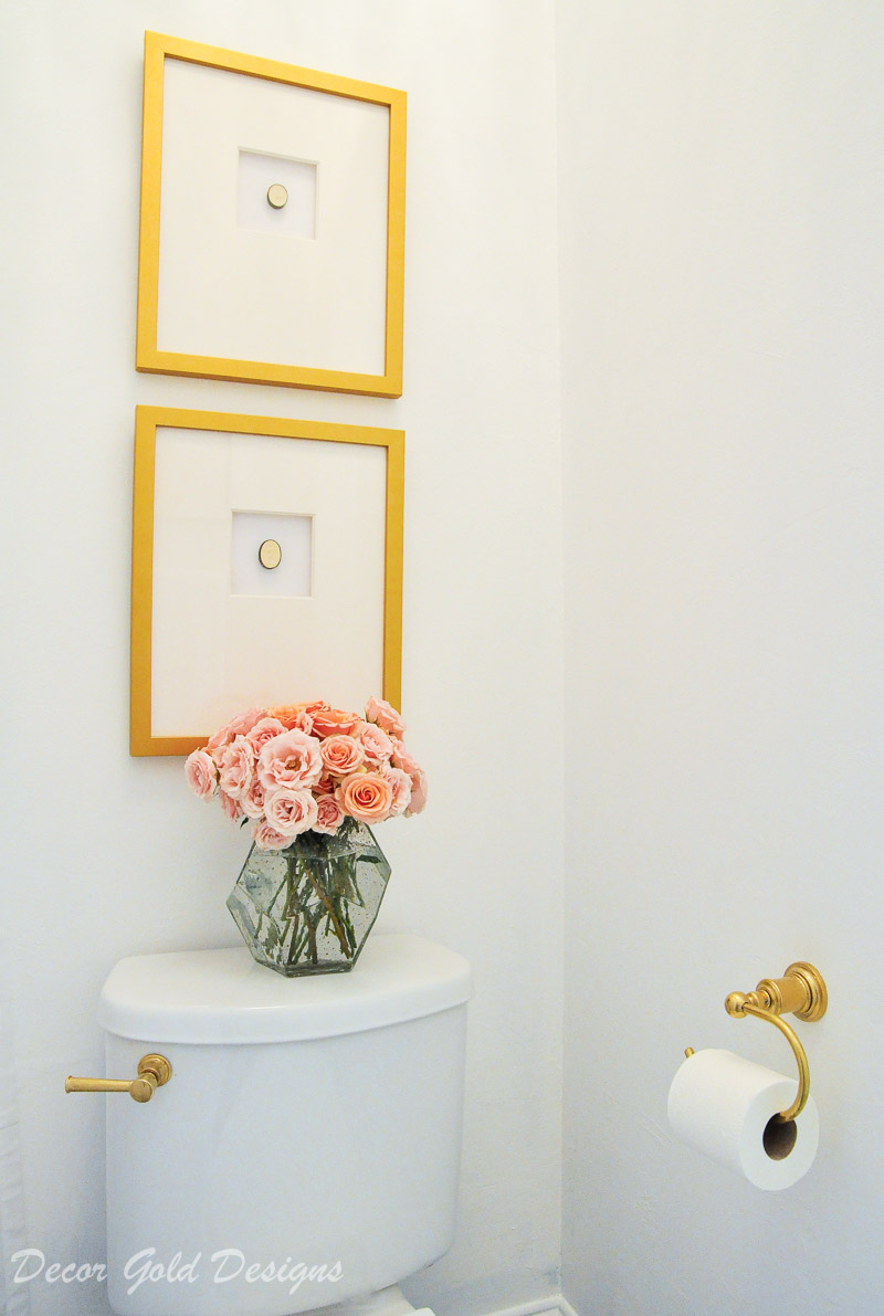 Beautiful powder bathroom brass accents art framed intaglios