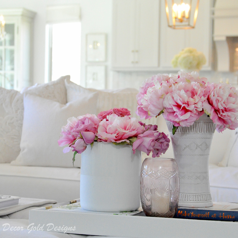 Coffee table styling pink flowers white vases