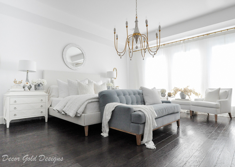 Master bedroom refresh white bed gold chandelier blue sofa