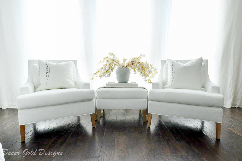 Master bedroom refresh white chairs ottoman