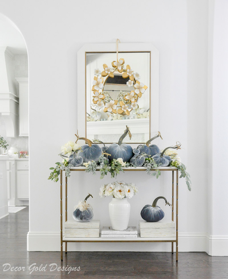 Beautiful pumpkin styling blue velvet pumpkins white console table