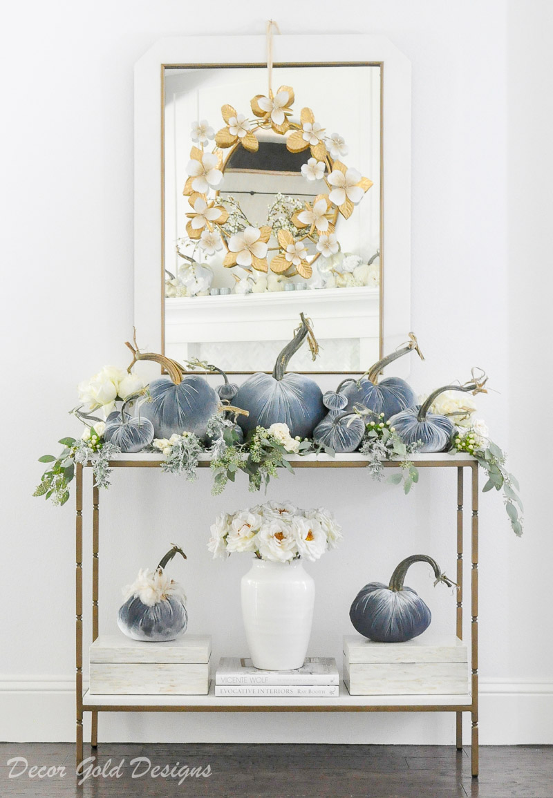 Beautiful pumpkin styling blue velvet pumpkins white console table