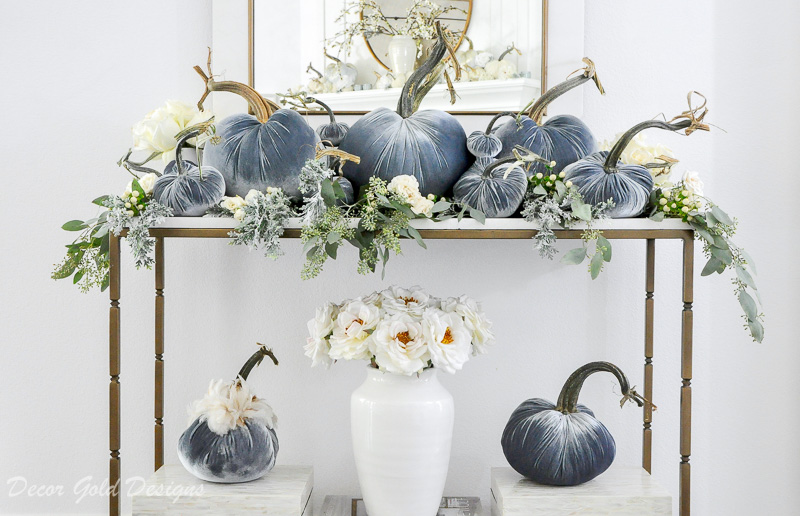 Beautiful pumpkin styling blue velvet pumpkins white console table