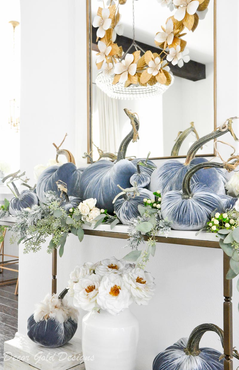 Beautiful pumpkin styling blue velvet pumpkins white console table