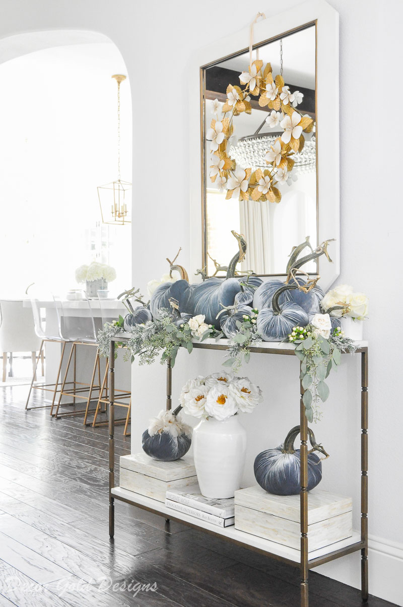 Beautiful pumpkin styling blue velvet pumpkins white console table