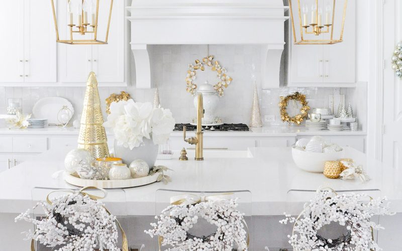 Bright cheerful Christmas kitchen decorated white berry wreaths