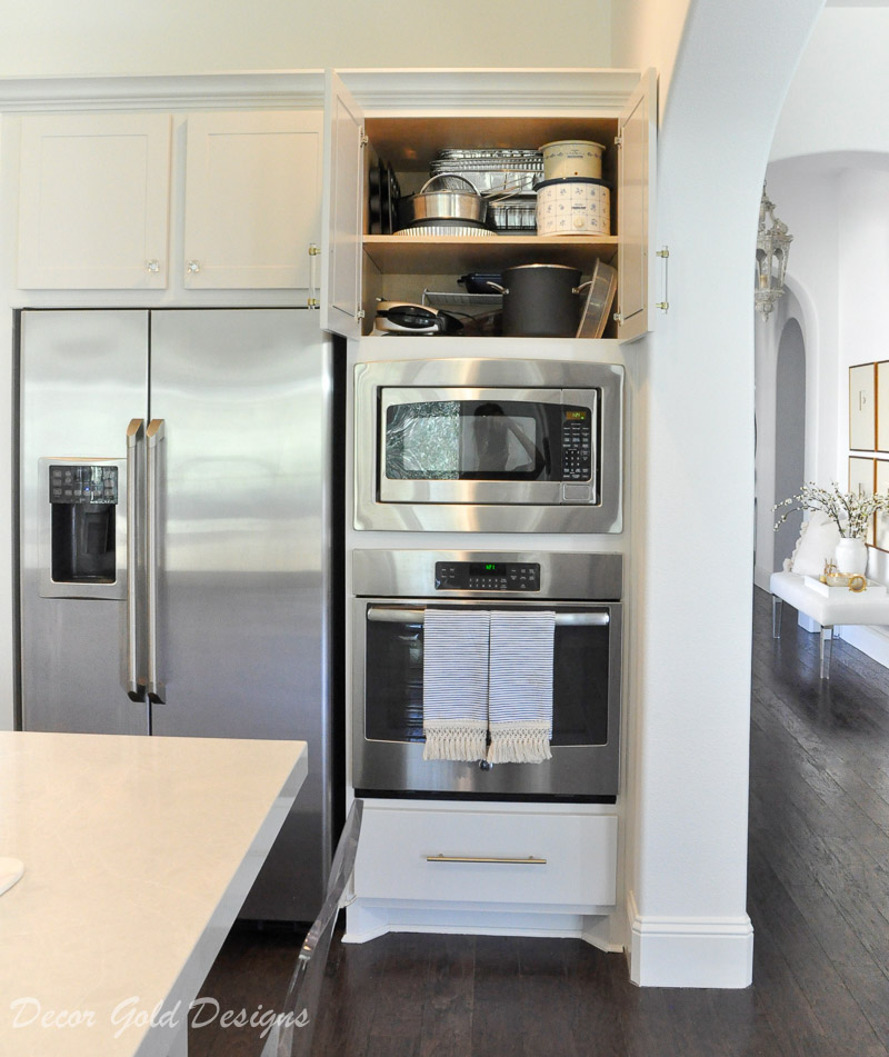 Kitchen organization project above oven cabinet