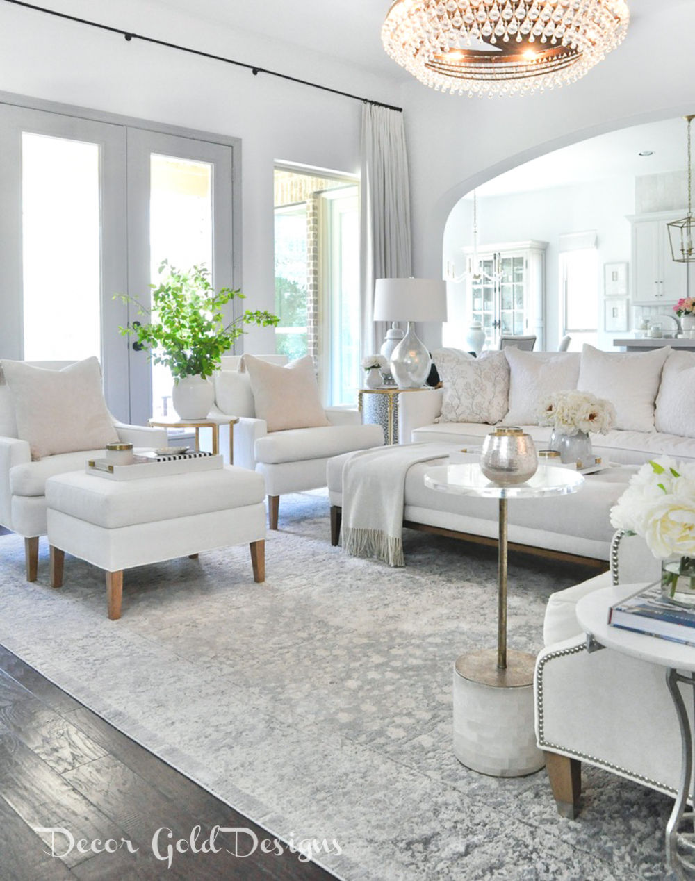 Spring home tour living room white furnishings bright green branches