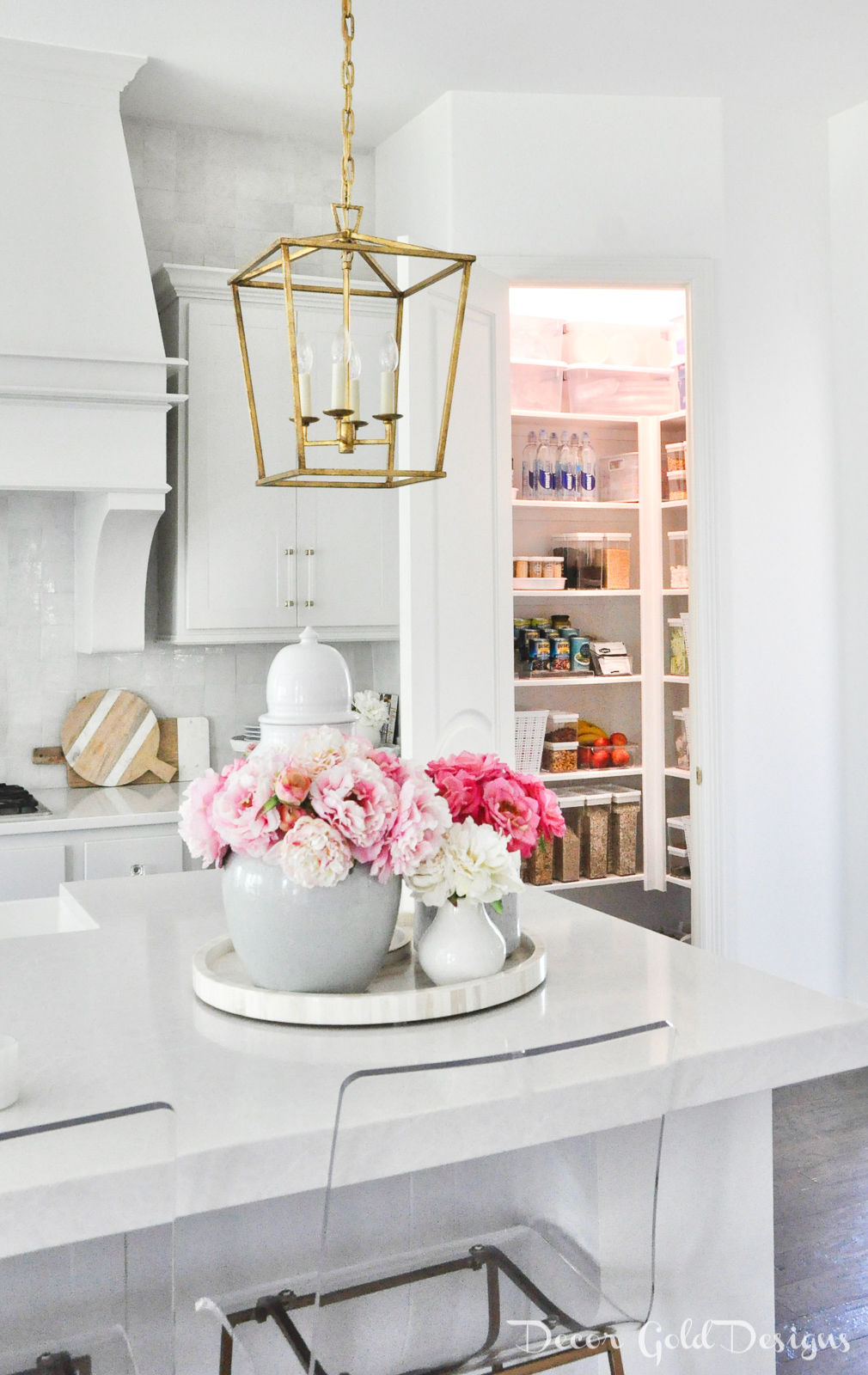 Bright organized corner pantry in a white kitchen