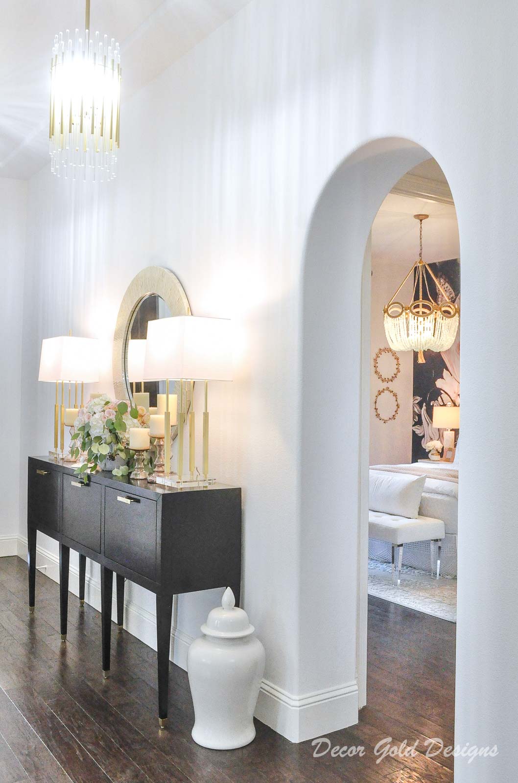 Entryway furniture, beautiful round mirror, elegant lamps