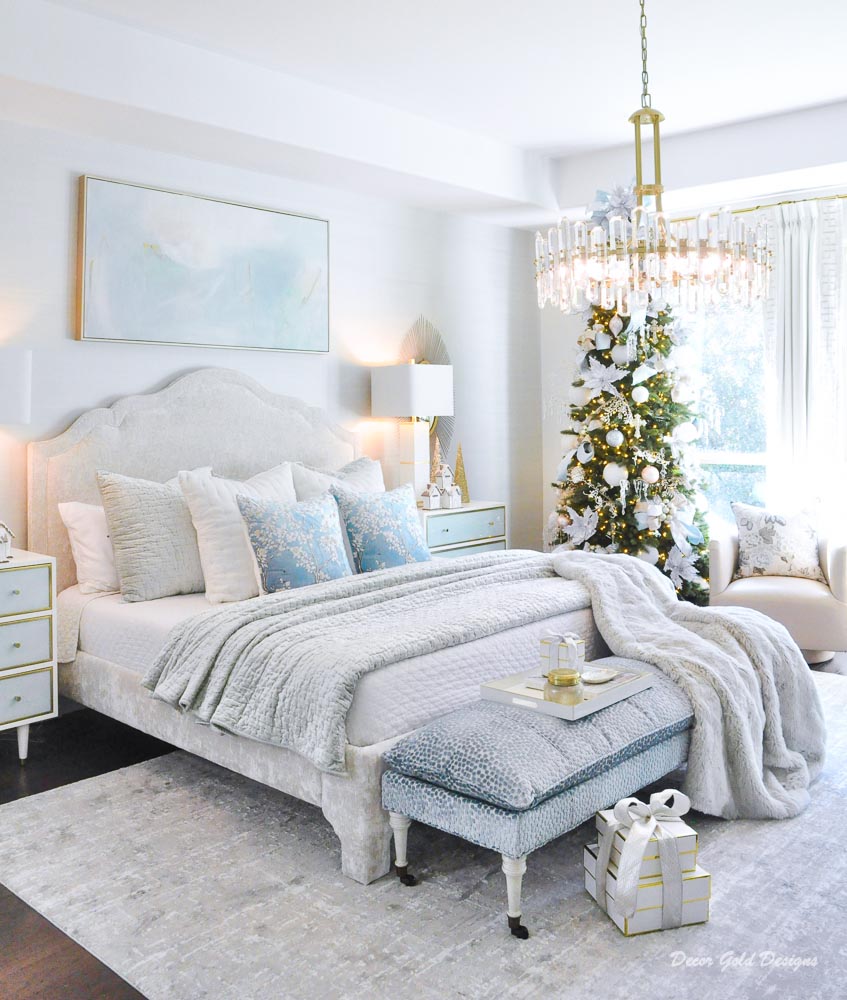 Christmas bedroom in pastels with a beautifully decorated tree