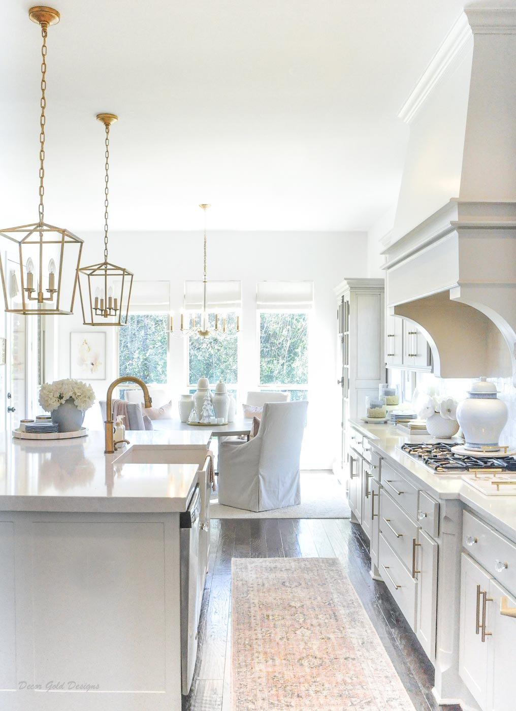 Winter white kitchen gold accents dining area